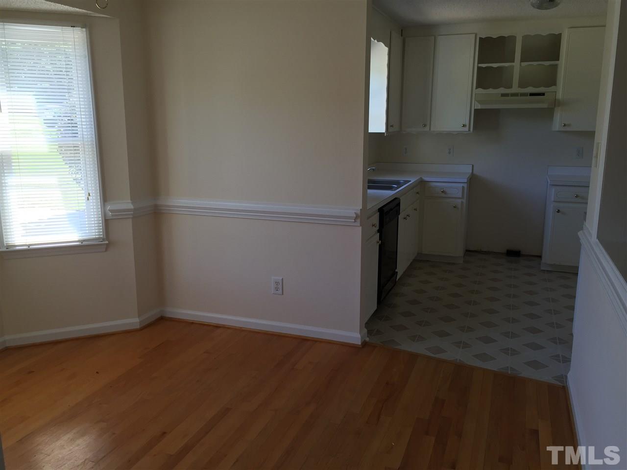 501 Jordan Ridge Lane Raleigh, NC 27603 - Photo 9 of 11 an empty room with wooden floor and a window
