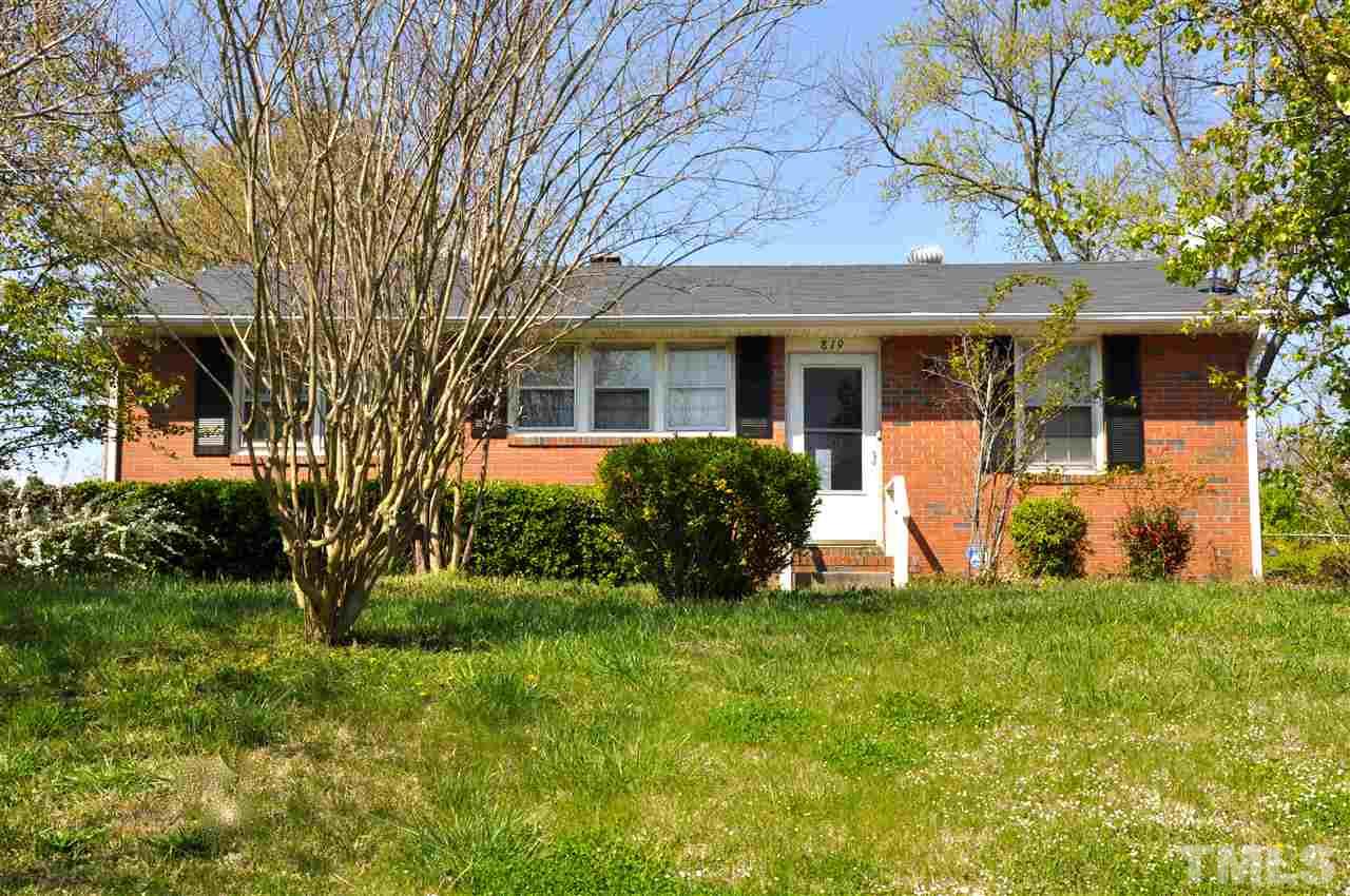 819 Hadley Road Raleigh, NC 27610 - Photo 2 of 20 a front view of a house with a yard and large tree