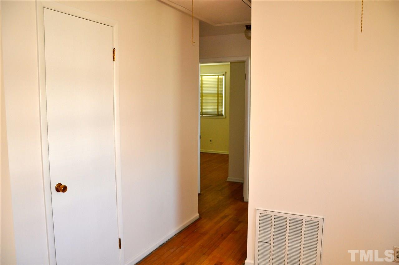 819 Hadley Road Raleigh, NC 27610 - Photo 11 of 20 a view of a bathroom from a hallway