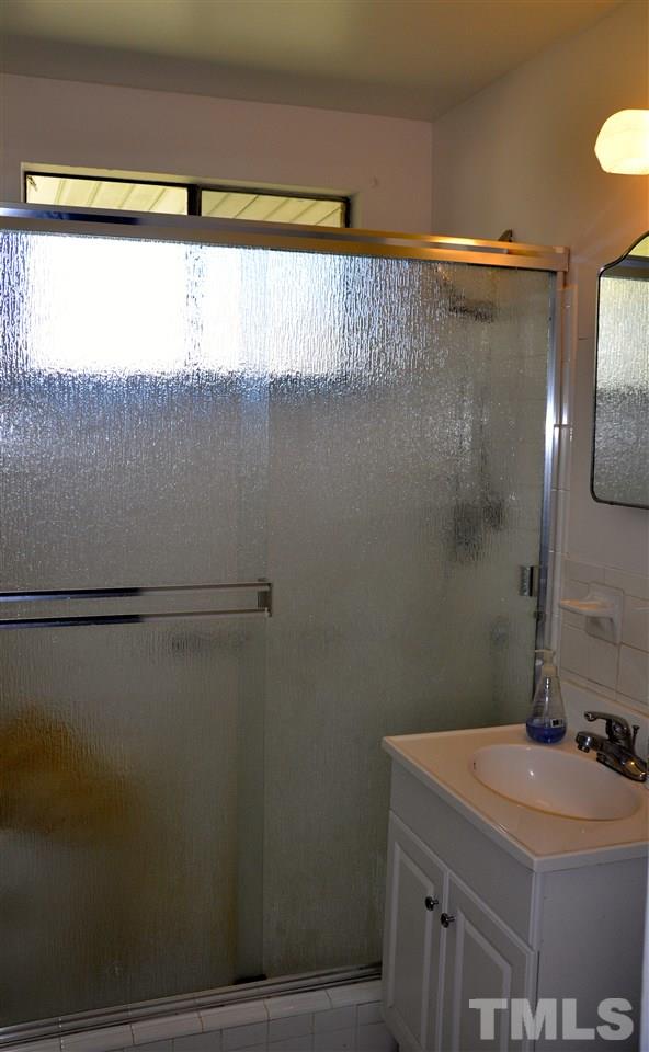 819 Hadley Road Raleigh, NC 27610 - Photo 12 of 20 a bathroom with a sink and a mirror