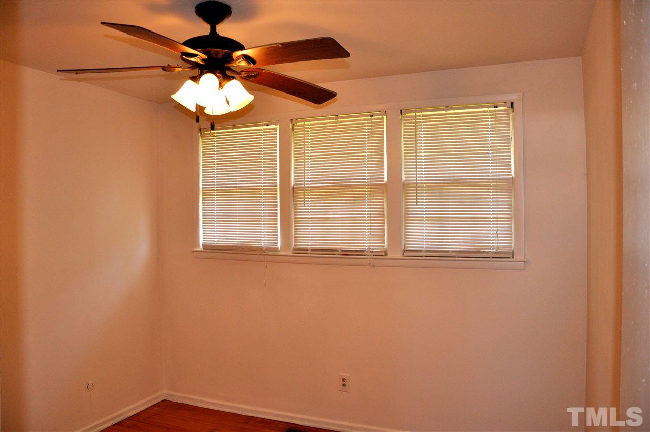 819 Hadley Road Raleigh, NC 27610 - Photo 18 of 20 a view of a livingroom with a ceiling fan and a window
