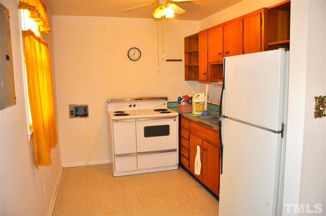 819 Hadley Road Raleigh, NC 27610 - Photo 7 of 20 a white refrigerator freezer a washer and dryer