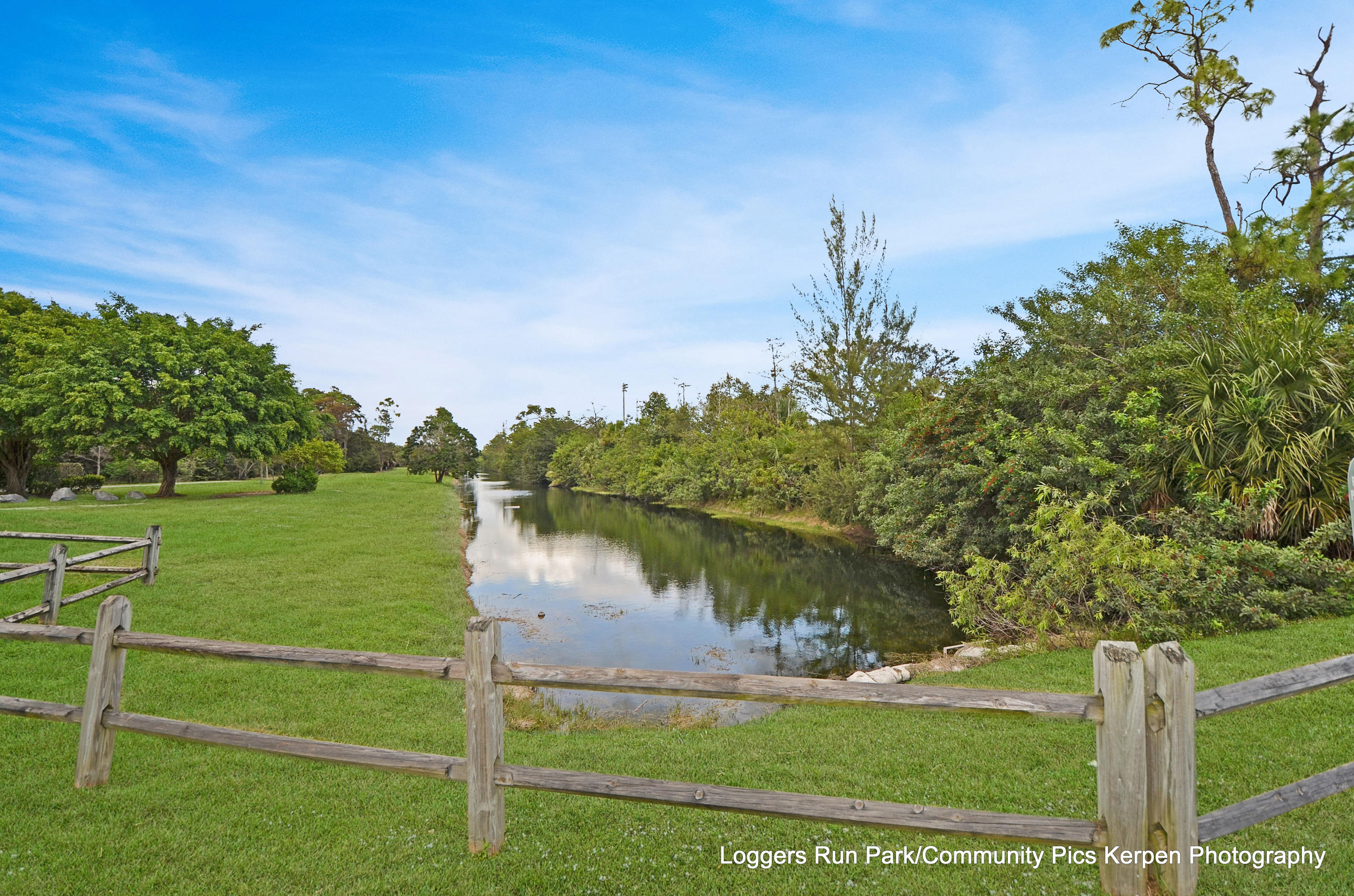 11682 Springflower Place Boca Raton, FL 33428 - Photo 66 of 66 a view of a lake with a big yard and potted plants