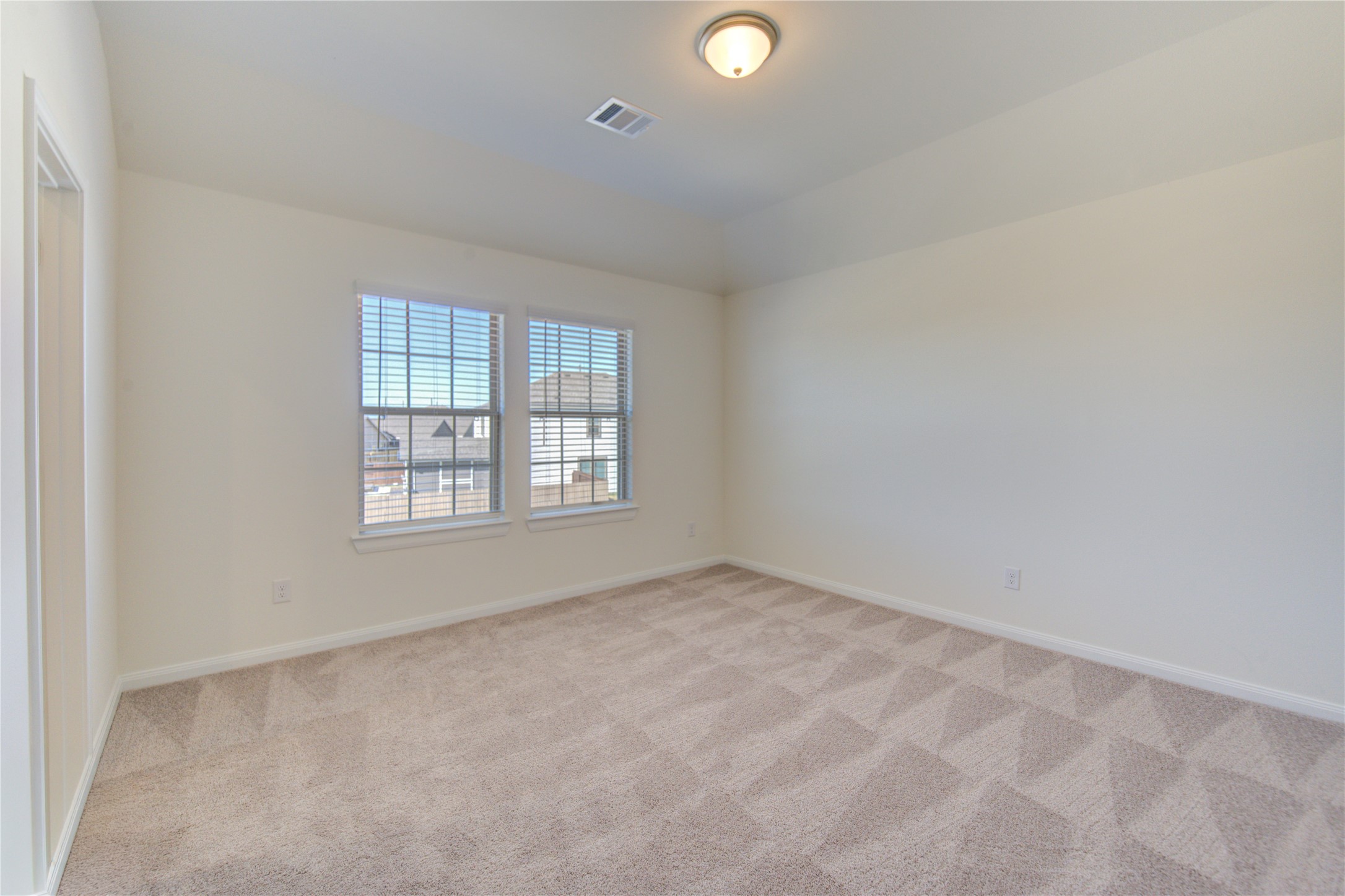 21707 Cypress Trellis Drive Cypress, TX 77433 - Photo 18 of 24 an empty room with windows