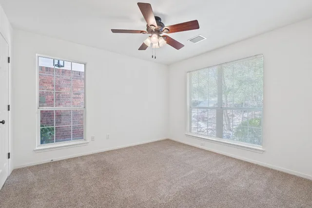 a bathroom with a granite countertop sink a mirror a shower and a bathtub
