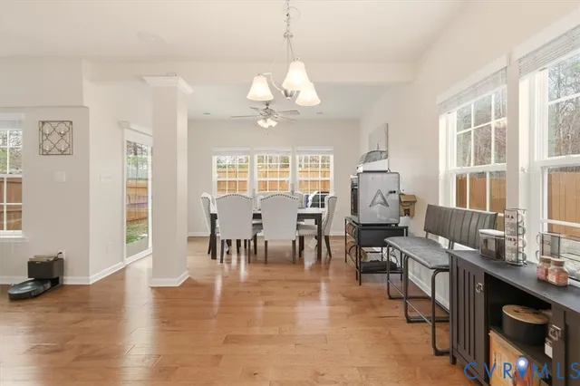 a kitchen with refrigerator and cabinets