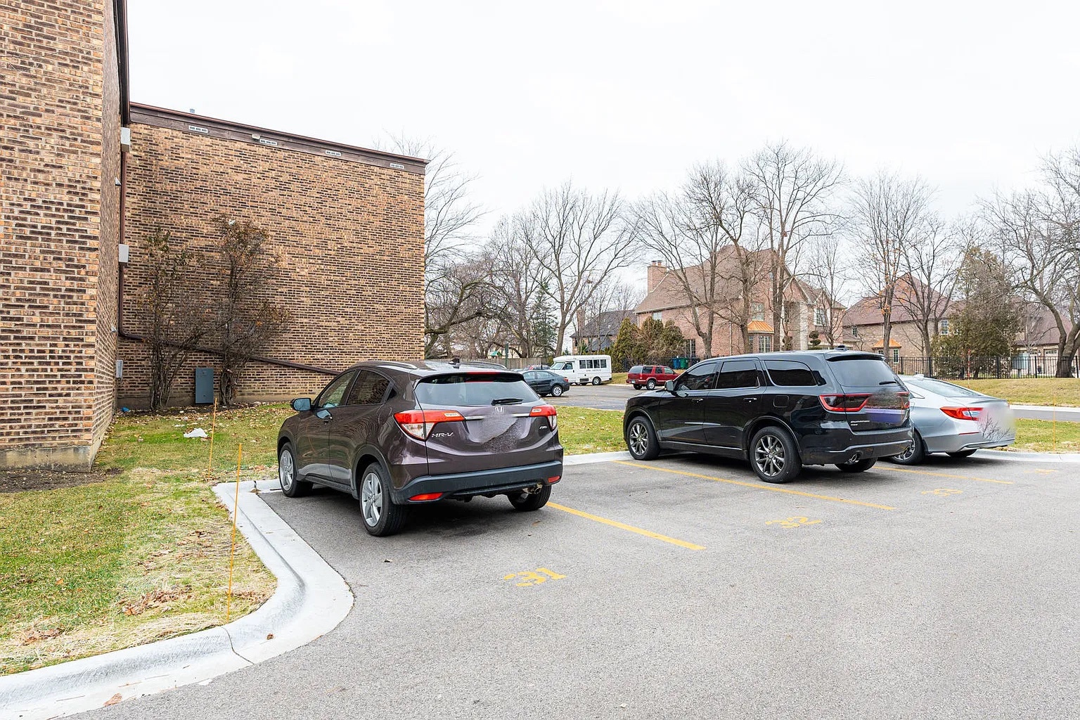 186 Dunteman Drive, Unit 301 Glendale Heights, IL 60139 - Photo 2 of 2 a car parked in front of a house