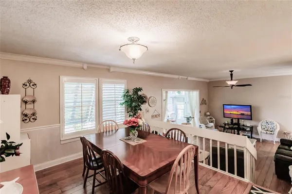 a view of a dining room with furniture and a livingroom