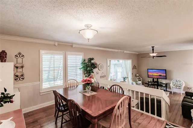 a view of a dining room with furniture and a livingroom