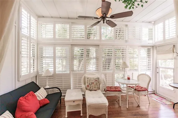 a dining room with furniture and wooden floor