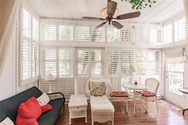 a dining room with furniture and wooden floor