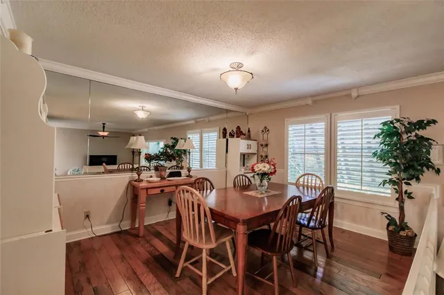 a view of a dining room with furniture and a livingroom