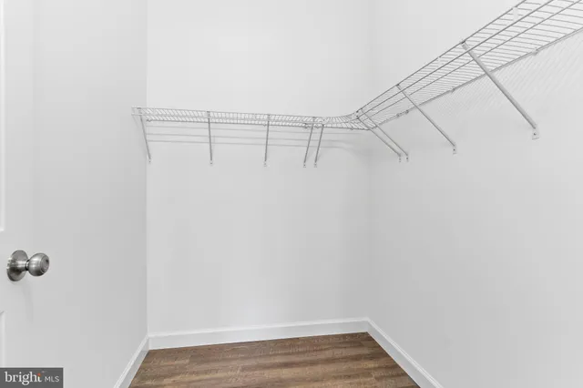 a bathroom with a sink toilet and a mirror