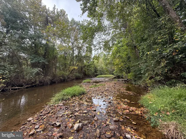 a view of a backyard of the house