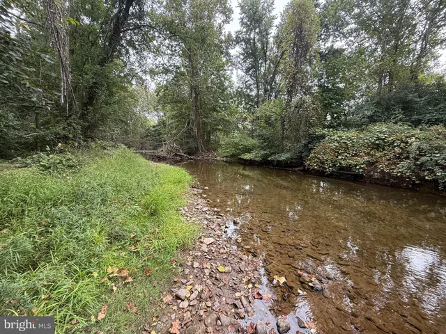 a view of a lake with a yard
