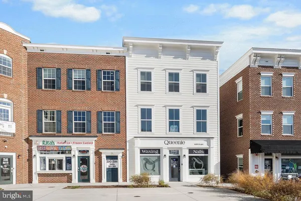 a front view of a building with a lot of windows