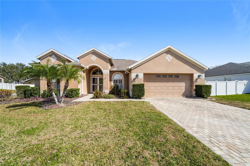 7901 Roundelay Drive New Port Richey, FL 34654 - Photo 1 of 1 a front view of a house with a yard
