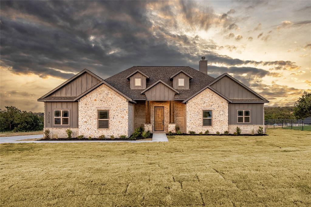 7004 Rnch Vw Place Springtown, TX 76082 - Photo 1 of 25 Stone and board-and-batten exterior with a gabled roofline