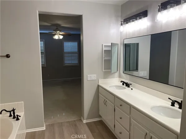 a bathroom with a bathtub and shower
