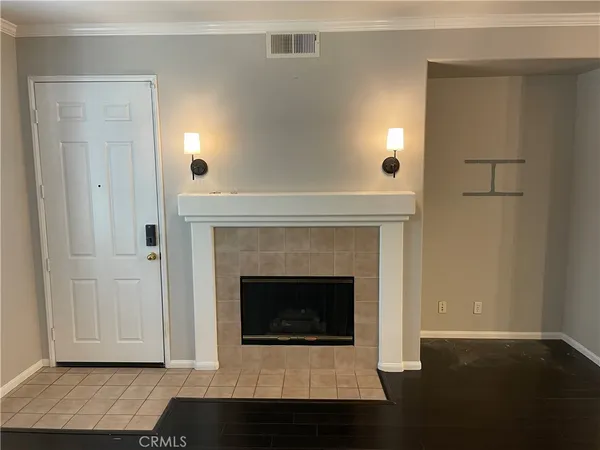 a view of a kitchen with a sink wooden floor and cabinets