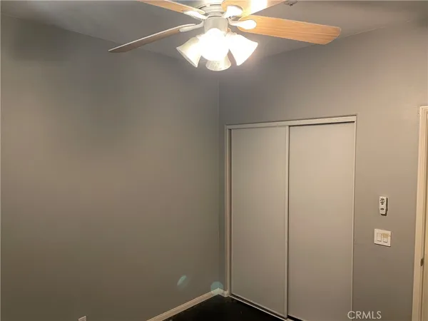 a bathroom with a toilet sink vanity tub and mirror