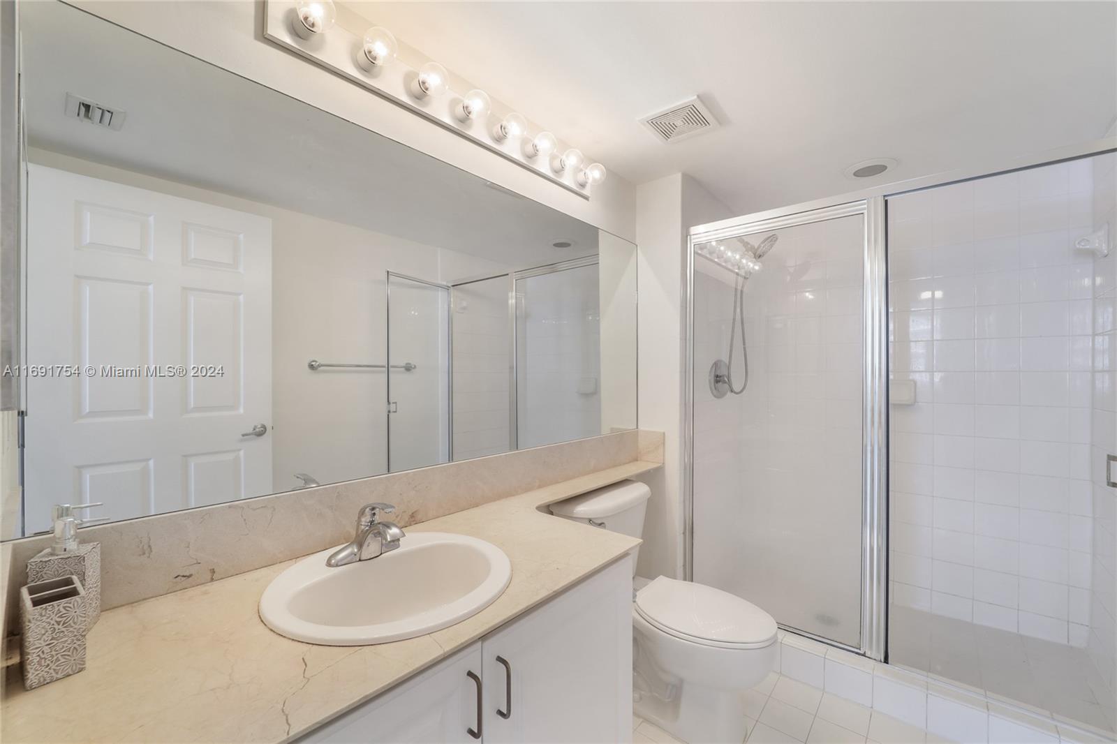 Brickell Miami, FL 33131 - Photo 6 of 14 a bathroom with a sink toilet and shower
