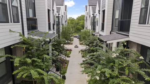 a view of a pathway besides a house