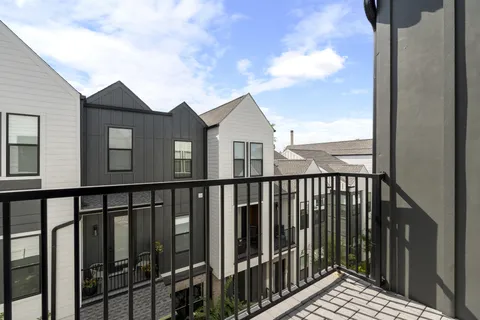 a bedroom with a bed and cabinets