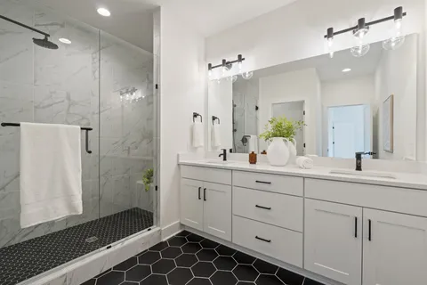 a bathroom with mirror and sink