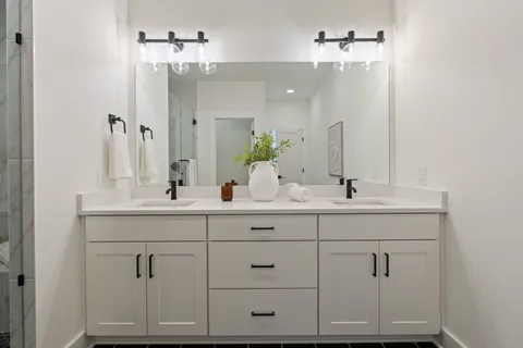 a bathroom with a shower and a sink