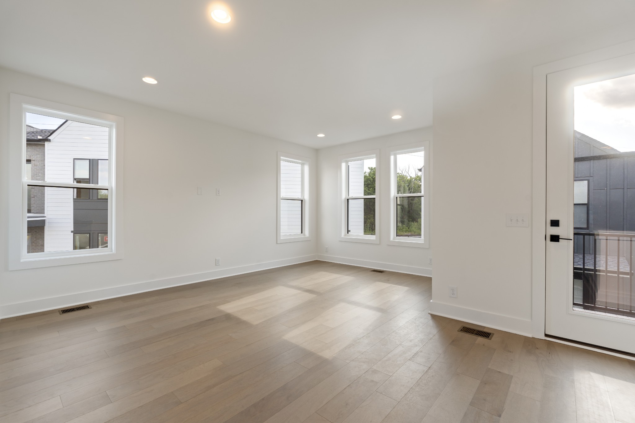 505 Community Court, Unit 11 Nashville, TN 37209 - Photo 29 of 37 an empty room with wooden floor and windows