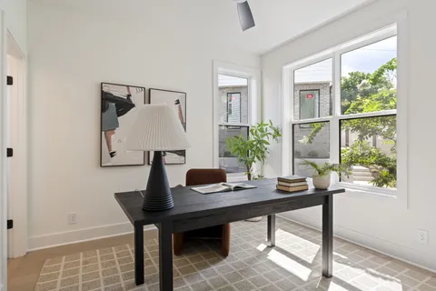 a view of a workspace with furniture