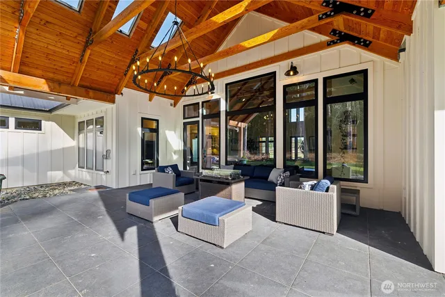 a patio with patio couch and glass door