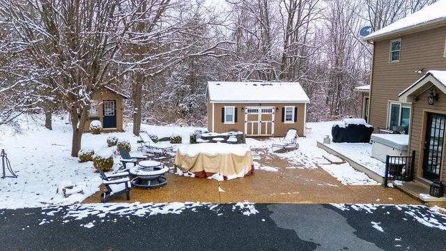 a view of a house with wooden fence