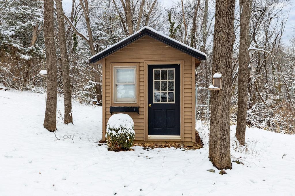 840 Commerce Road Staunton, VA 24401 - Photo 16 of 67 a front view of a house with a yard covered in snow