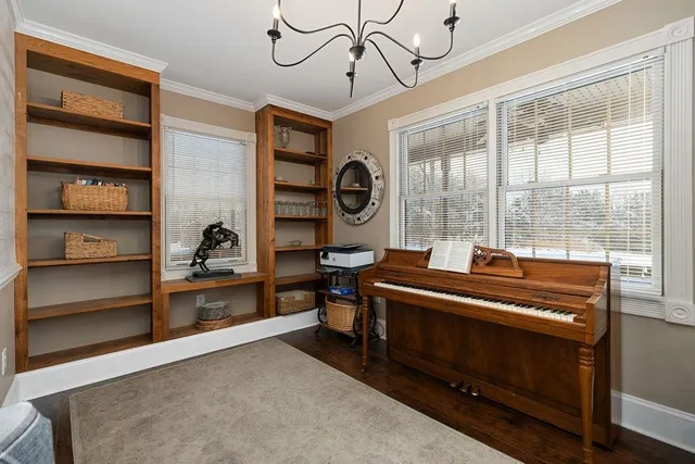 a kitchen with stainless steel appliances kitchen island granite countertop a refrigerator and a stove top oven