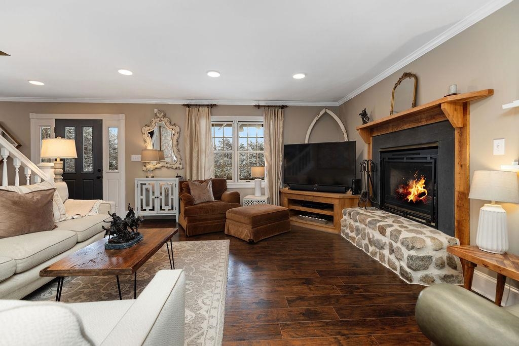 840 Commerce Road Staunton, VA 24401 - Photo 33 of 67 a living room with furniture a flat screen tv and a fireplace