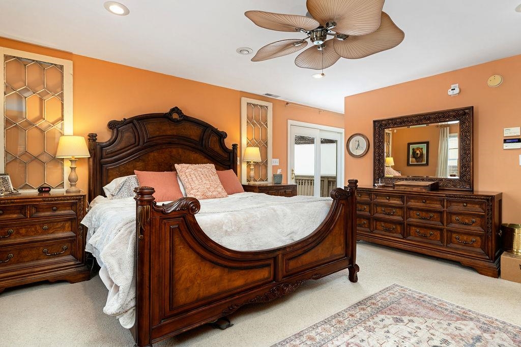 840 Commerce Road Staunton, VA 24401 - Photo 40 of 67 a bed room with a bed and a chandelier
