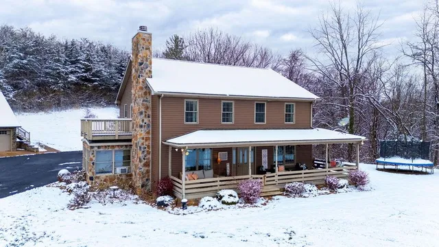 a front view of house with yard outdoor seating and barbeque oven