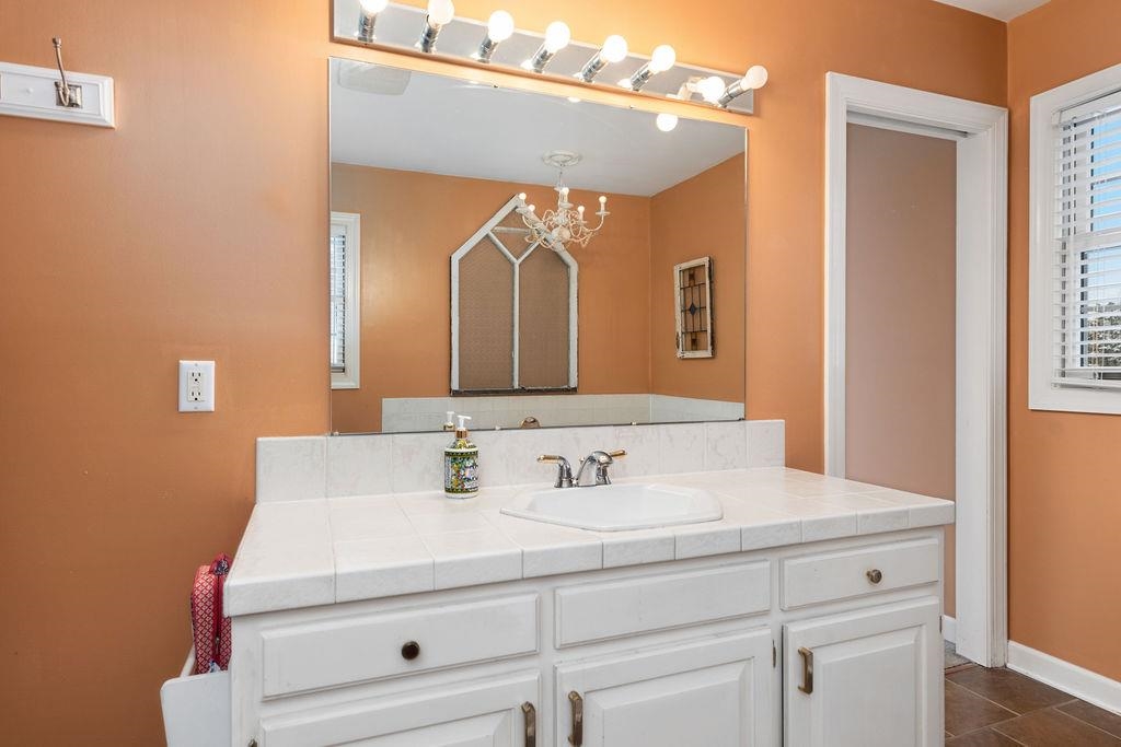 840 Commerce Road Staunton, VA 24401 - Photo 43 of 67 a bathroom with a sink and a mirror