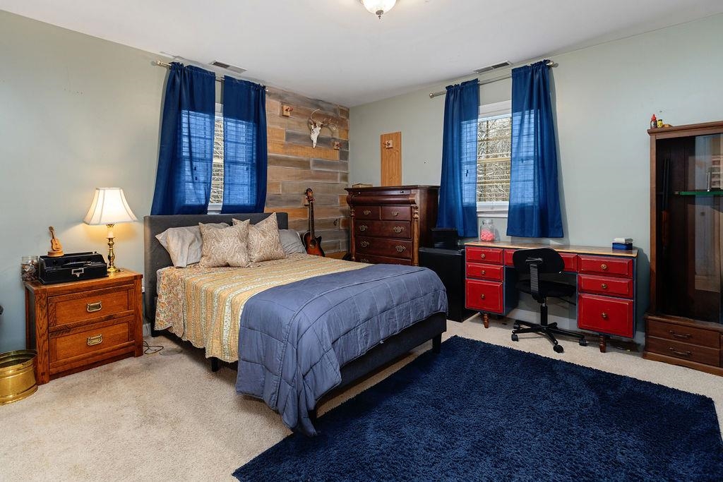 840 Commerce Road Staunton, VA 24401 - Photo 46 of 67 a bedroom with a bed and wooden floor