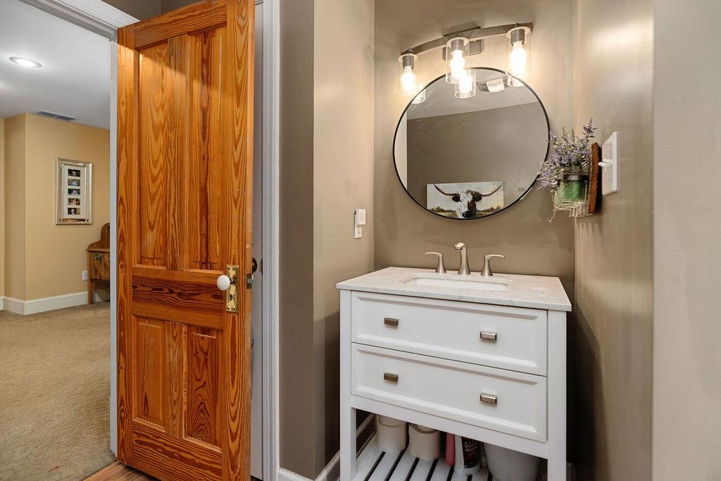 840 Commerce Road Staunton, VA 24401 - Photo 50 of 67 a bathroom with a sink a mirror and a vanity