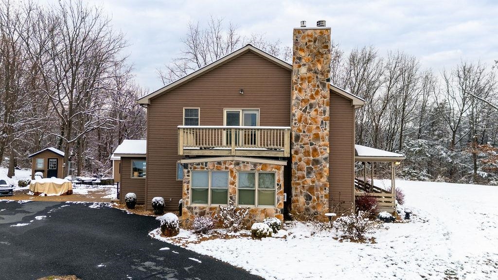 840 Commerce Road Staunton, VA 24401 - Photo 8 of 67 a front view of a house with a yard covered in snow