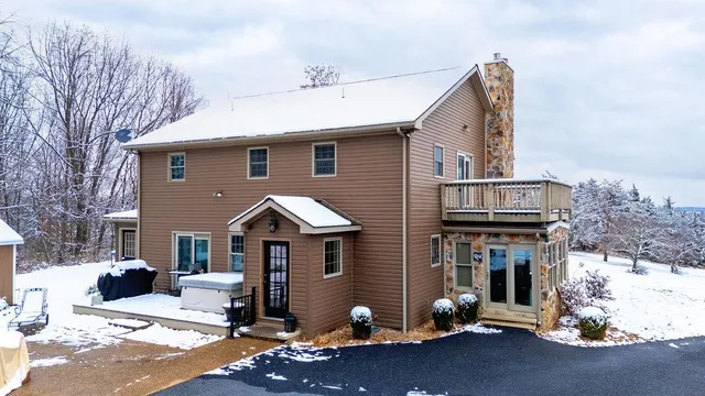 a view of backyard with deck and wooden floor