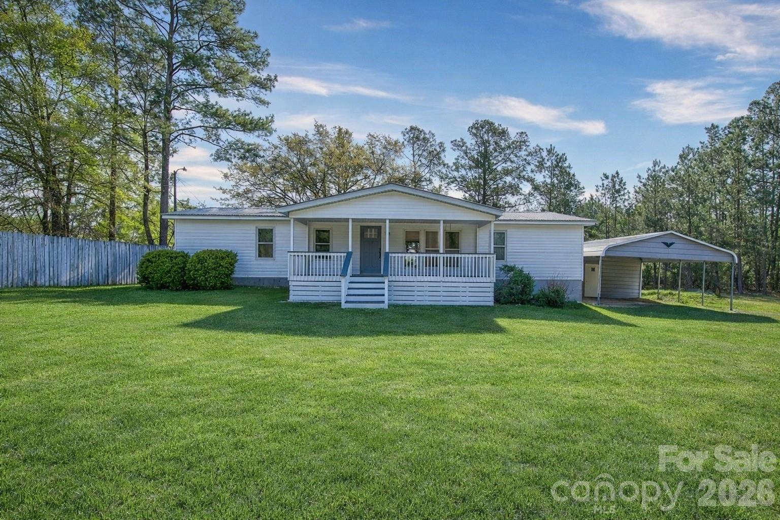 4282 Fred Gardner Road Kershaw, SC 29067 - Photo 1 of 36 a front view of a house with garden