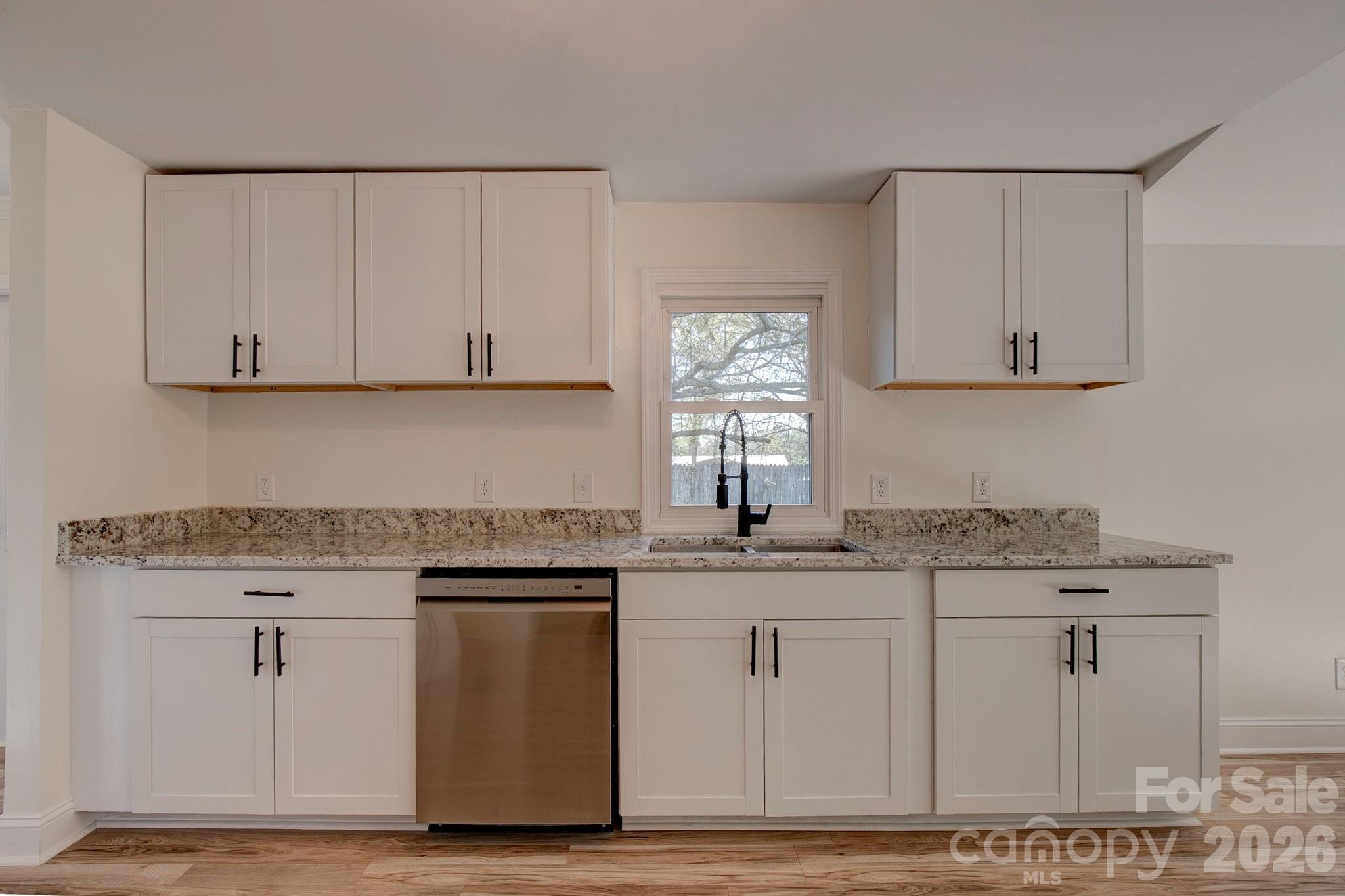 4282 Fred Gardner Road Kershaw, SC 29067 - Photo 15 of 36 a kitchen with stainless steel appliances granite countertop a sink stove and cabinets