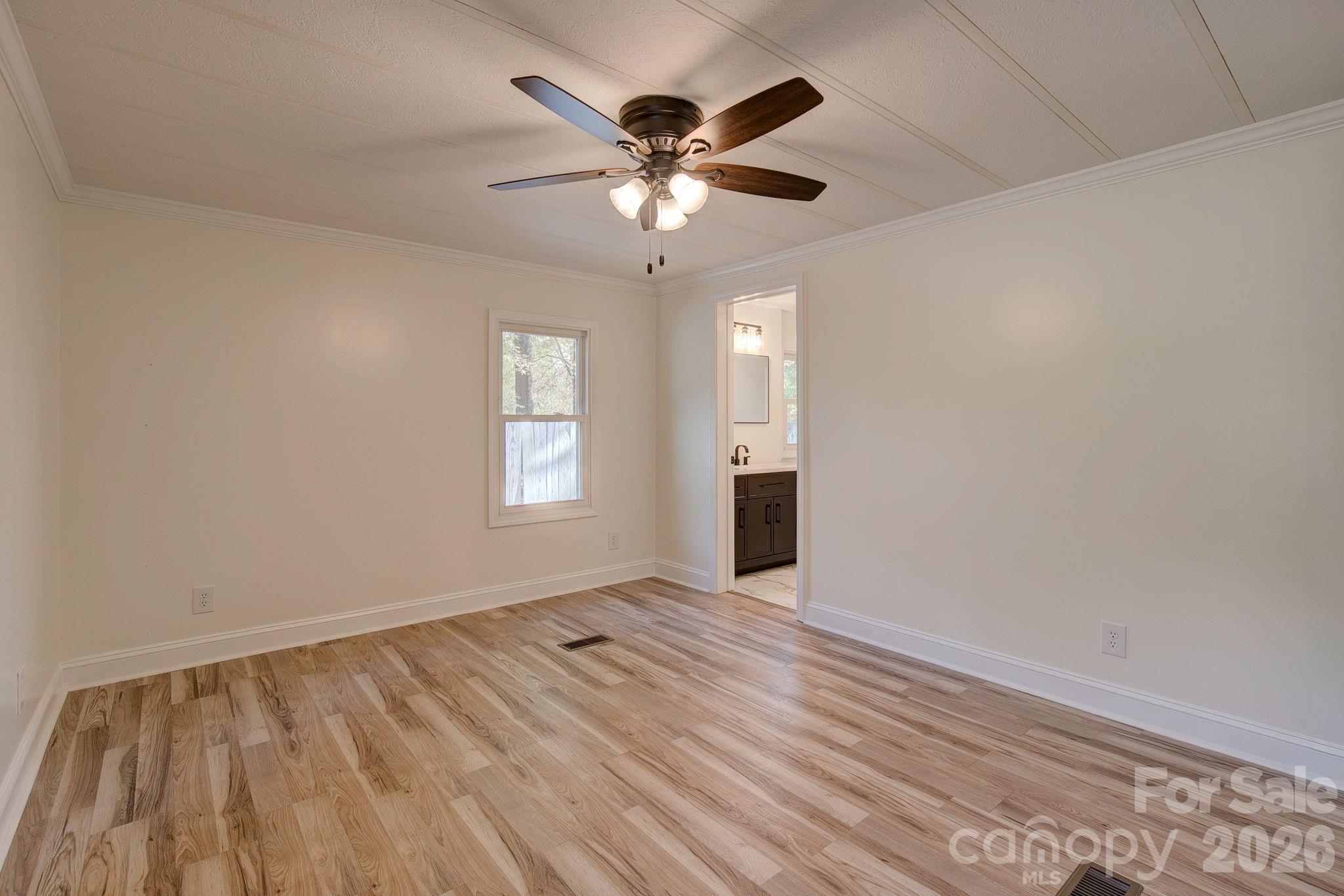 4282 Fred Gardner Road Kershaw, SC 29067 - Photo 19 of 36 wooden floor in an empty room with a window