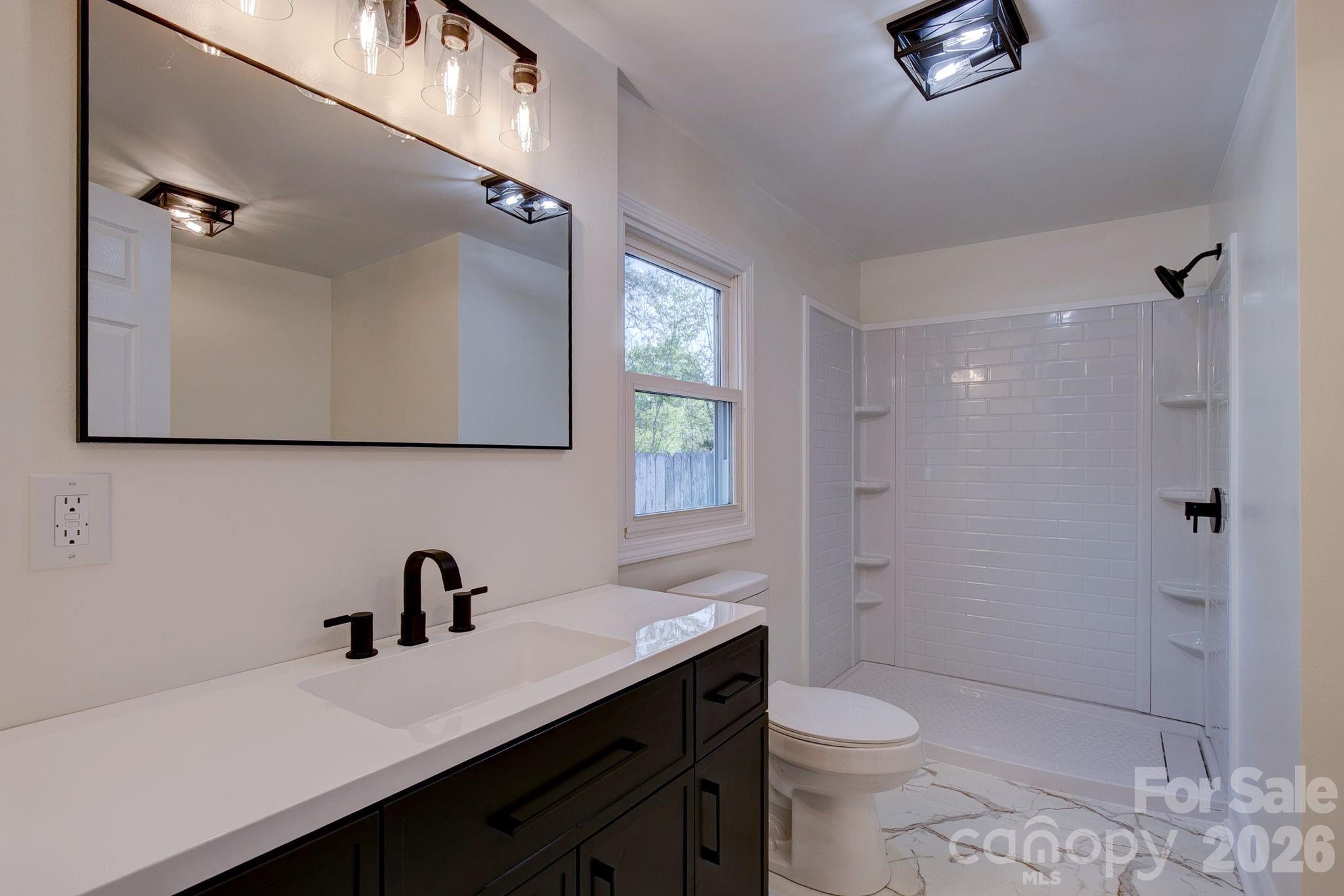 4282 Fred Gardner Road Kershaw, SC 29067 - Photo 24 of 36 a bathroom with a double vanity sink toilet and shower