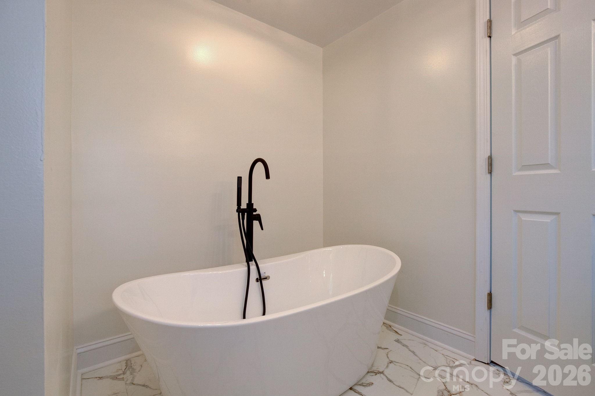4282 Fred Gardner Road Kershaw, SC 29067 - Photo 25 of 36 a white bath tub sitting in a bathroom
