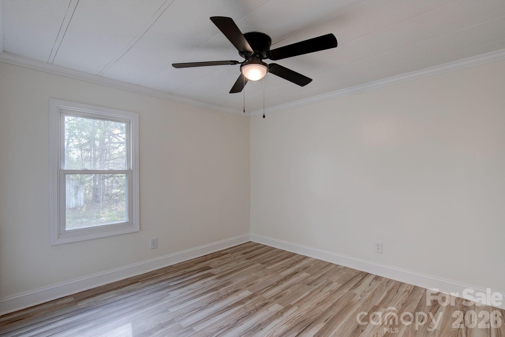 4282 Fred Gardner Road Kershaw, SC 29067 - Photo 30 of 36 a view of empty room with wooden floor and fan